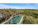 Community bocce ball court with green surface and benches at 287 Cassano Dr, Nokomis, FL 34275