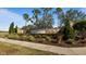 Community entrance sign with landscaping and walkway at 287 Cassano Dr, Nokomis, FL 34275