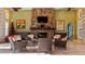 Relaxing seating area with a stone fireplace at 287 Cassano Dr, Nokomis, FL 34275