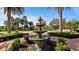 Ornate fountain in landscaped courtyard at 287 Cassano Dr, Nokomis, FL 34275