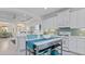 Kitchen island with teal accents, and white cabinetry at 287 Cassano Dr, Nokomis, FL 34275