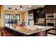 Community kitchen with granite countertops and island at 287 Cassano Dr, Nokomis, FL 34275