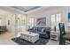 Living room with gray sofa and white coffee table at 287 Cassano Dr, Nokomis, FL 34275