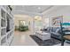 Bright living room with gray sofa and built in shelving at 287 Cassano Dr, Nokomis, FL 34275