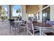 Outdoor patio with tables and chairs near the pool at 287 Cassano Dr, Nokomis, FL 34275