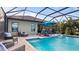 Relaxing pool area with covered patio and comfortable seating at 287 Cassano Dr, Nokomis, FL 34275
