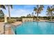 Refreshing pool with a water feature and lounge area at 287 Cassano Dr, Nokomis, FL 34275