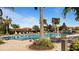 Inviting community pool with surrounding lounge chairs at 287 Cassano Dr, Nokomis, FL 34275