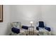 Cozy sitting area with two armchairs and a side table at 287 Cassano Dr, Nokomis, FL 34275