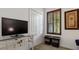 Comfortable sitting area with large TV and ample storage at 287 Cassano Dr, Nokomis, FL 34275