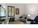 Relaxing sitting area with plantation shutters and comfy chair at 287 Cassano Dr, Nokomis, FL 34275