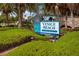 Venice Beach sign in a landscaped area with palm trees at 287 Cassano Dr, Nokomis, FL 34275