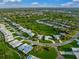 Aerial view of community showcasing homes and green space at 3305 Village Green Dr, Sarasota, FL 34239