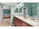 Double vanity bathroom with granite countertop and a view into a bedroom at 3694 Lakewood Blvd, North Port, FL 34287