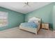 Main bedroom with light green walls, a ceiling fan, and a queen bed at 3694 Lakewood Blvd, North Port, FL 34287