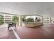 Covered walkway with a bench, overlooking a lush courtyard at 3730 Cadbury Cir # 420, Venice, FL 34293