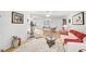 Living room with hardwood floors, white couch, and a ceiling fan at 4160 Fruitville Rd # 14, Sarasota, FL 34232