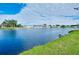 Peaceful pond view with lush green landscape at 441 Circlewood Dr # M6, Venice, FL 34293