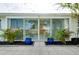 View of the back patio from inside the home through sliding glass doors at 441 Circlewood Dr # M6, Venice, FL 34293