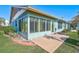 Spacious sunroom addition with multiple windows and a patio at 510 Pendleton Pl, Venice, FL 34292