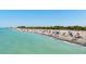 Peaceful beach with turquoise water and many people at 515 Governors Green Dr, Venice, FL 34293