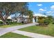 Home exterior with landscaped yard and paved driveway at 515 Governors Green Dr, Venice, FL 34293