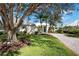 Stunning curb appeal with mature trees and a welcoming entrance at 515 Governors Green Dr, Venice, FL 34293