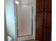 Bathroom with shower and built-in cabinets at 657 N Green Cir, Venice, FL 34285
