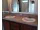 Double vanity bathroom with sinks and mirror at 657 N Green Cir # 182, Venice, FL 34285