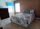 Bedroom with double bed, dresser, and window at 657 N Green Cir, Venice, FL 34285