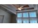 Bright bedroom with ceiling fan and large window at 657 N Green Cir, Venice, FL 34285