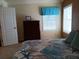 Spacious bedroom with large bed and dresser at 657 N Green Cir, Venice, FL 34285