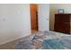 Bedroom with double bed, dresser, and walk-in closet at 657 N Green Cir, Venice, FL 34285