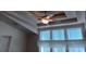 Bright bedroom with ceiling fan and large window at 657 N Green Cir, Venice, FL 34285