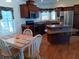 Kitchen with island and dining area at 657 N Green Cir, Venice, FL 34285