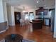 Open kitchen with dark wood cabinets and island at 657 N Green Cir # 182, Venice, FL 34285