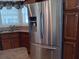 Stainless steel refrigerator in kitchen at 657 N Green Cir, Venice, FL 34285
