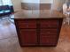 Kitchen island with granite countertop and drawers at 657 N Green Cir, Venice, FL 34285