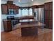 Modern kitchen with stainless steel appliances and granite countertops at 657 N Green Cir, Venice, FL 34285