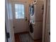 Convenient laundry room with washer, dryer, and exterior access at 657 N Green Cir, Venice, FL 34285