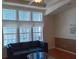 Spacious living room with large windows and a comfy couch at 657 N Green Cir, Venice, FL 34285