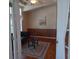 Living room with dark leather couch and area rug at 657 N Green Cir, Venice, FL 34285