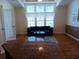 Living room with hardwood floors and large windows at 657 N Green Cir, Venice, FL 34285