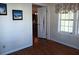 Sunroom with hardwood floors and access to other rooms at 657 N Green Cir, Venice, FL 34285