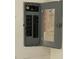 Open electrical panel displaying circuit breakers and wiring at 704 Chippy Ln, Nokomis, FL 34275