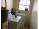 Laundry room with washer, dryer, and water heater at 704 Chippy Ln, Nokomis, FL 34275