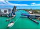 Sailboat passing under a drawbridge with several other boats out on the water at 704 Chippy Ln, Nokomis, FL 34275