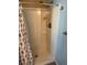 Bathroom with shower/tub combo, shower curtain, and built-in shelves at 708 Roma Rd, Venice, FL 34285