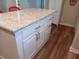 White kitchen cabinets and drawers with granite countertop at 723 S Green Cir, Venice, FL 34285