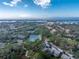 Community view showcasing condos, tennis courts, and waterways at 752 Pine Run Dr, Osprey, FL 34229